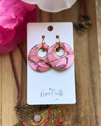 Pink marble-patterned round drop earrings with gold-tone hoops