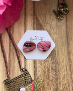 Small pebble faux stone stud earrings in pink and black