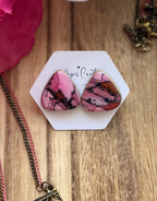 Large faux stone triangle stud earrings in marbled pink and black