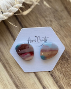 Small pebble faux stone stud earrings in turquoise and sand