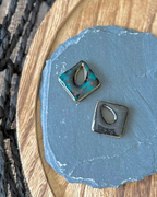 Diamond shaped charm with a teardrop keyhole in reversible jade and black
