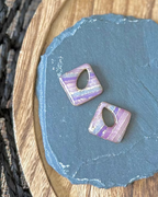 Diamond shaped charm with a teardrop keyhole in pale pastel stripes